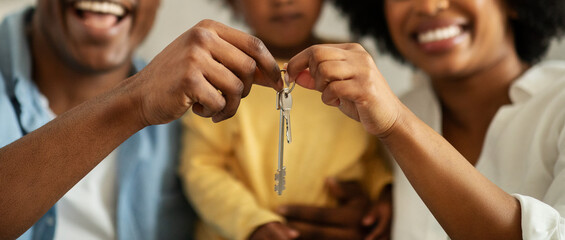 Cropped of african american family holding key form new home