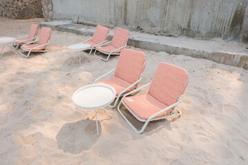 Beach chair on white sand in summer.