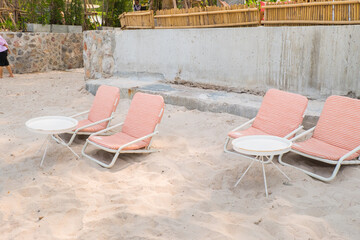 Beach chair on white sand in summer.
