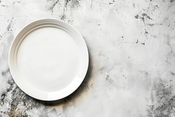 A white plate rests on a marble counter, offering a clean and elegant display surface
