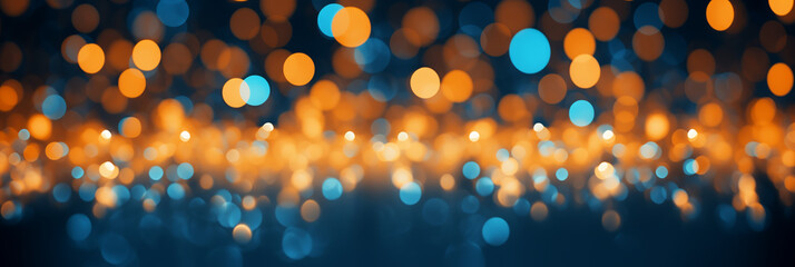 efocused lights creating a warm bokeh effect on a blue background. Festive and holiday concept.