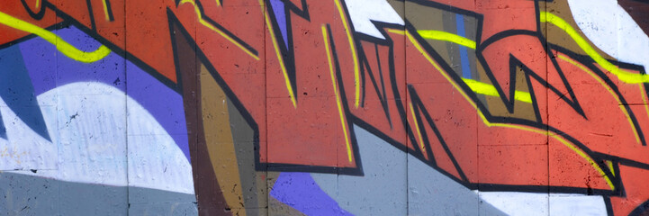 Colorful background of graffiti painting artwork with bright aerosol outlines on wall. Old school...
