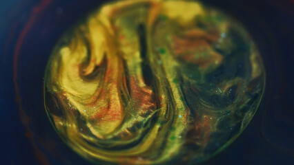 Glitter bubbles. Oil blob. Defocused golden blue color shimmering texture paint water mix swirl...
