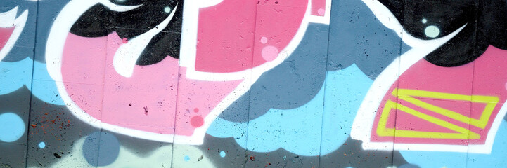 Colorful background of graffiti painting artwork with bright aerosol outlines on wall. Old school...