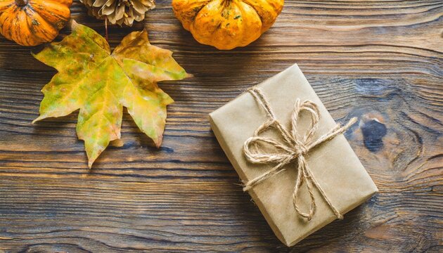 autumn themed composition with wrapped gift rustic background fall concept flat lay copy space
