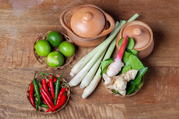 tom yum spicy soup ingredient on wooden rustic background