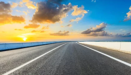 Foto op Canvas asphalt highway and beautiful clouds landscape at sunset © Claudio