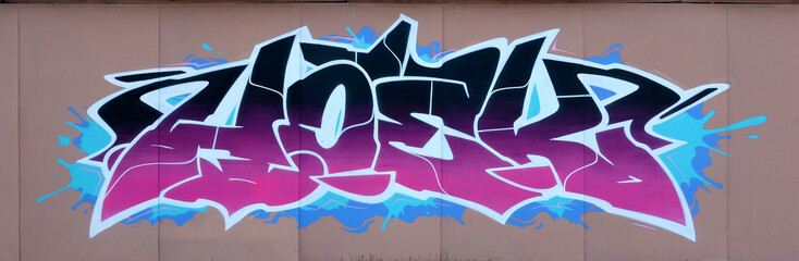 The old wall decorated with paint stains in the style of street art culture. Colorful background of...