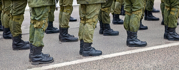 Army Soldiers In Uniform Standing In A Row On Parade Ground During Inspection
