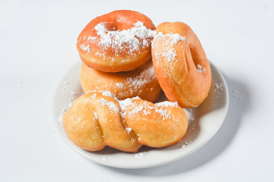 Close up of original donuts without toppings on a white background. Isolated objects
