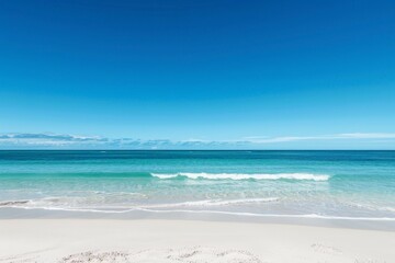 Fototapeta na wymiar A panoramic view of a coastal paradise with a white sandy beach and clear blue skies.