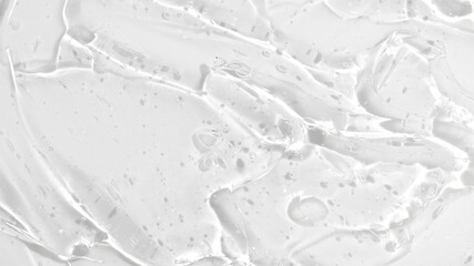 Transparent liquid gel on white background. Cosmetic skincare product texture. Face cream, body lotion swipe swatch