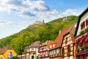 The Château de Saint-Ulrich hilltop castle rises above the medieval Alsatian town of Ribeauville,...