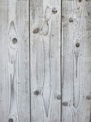 Texture of wood background closeup, top view, smooth surface with natural pattern and various wood grain and knots details. 