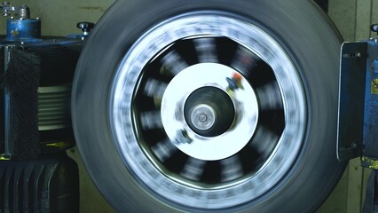 Industrial production or restoration, vulcanization of rubber tires on car wheels for the summer or winter season on professional equipment in automated production
