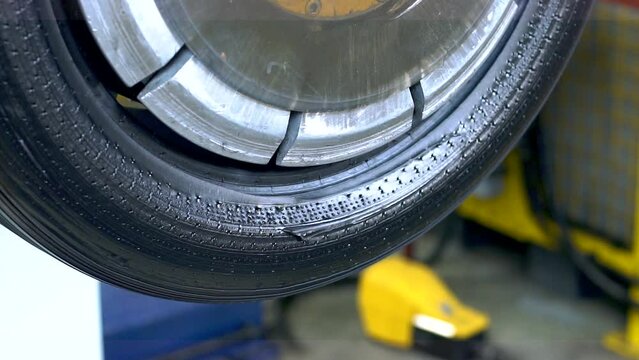 Industrial production or restoration, vulcanization of rubber tires on car wheels for the summer or winter season on professional equipment in automated production