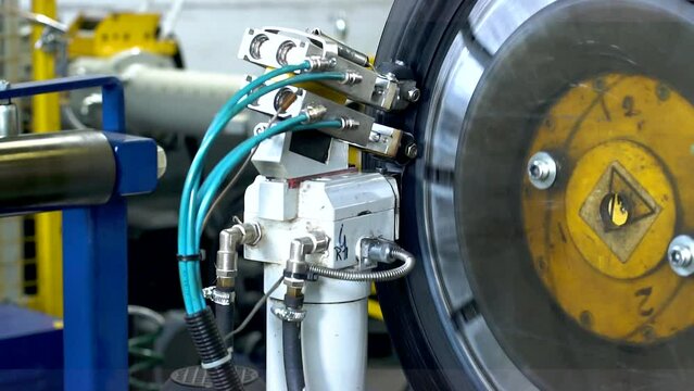 Industrial production or restoration, vulcanization of rubber tires on car wheels for the summer or winter season on professional equipment in automated production