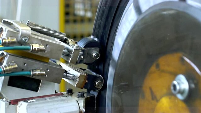 Industrial production or restoration, vulcanization of rubber tires on car wheels for the summer or winter season on professional equipment in automated production