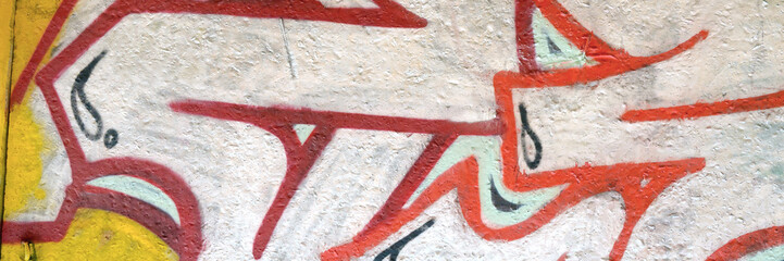 Colorful background of graffiti painting artwork with bright aerosol outlines on wall. Old school...