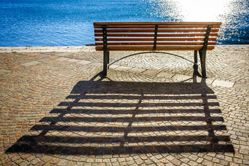 old wooden bench at torbole - 755115469