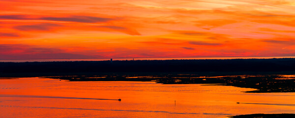 Fiery Sunset Over the Bay