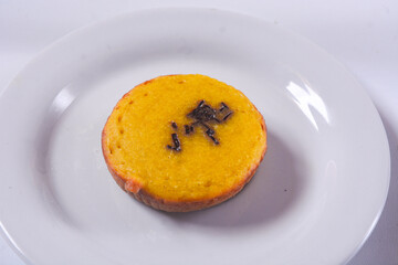 The hands of pukis cake seller who is cooking pukis cakes. Pukis cake is one of traditional cakes from Indonesia