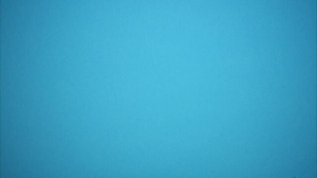 Vision improvement choice. Contact lenses and glasses near the eye test on a blue background. Stop motion