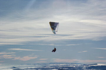 Paragliding. Extreme sport. paragliding flight in the mountains in France. Paragliding over the...