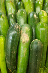 Stack of cucumbers on a market stall