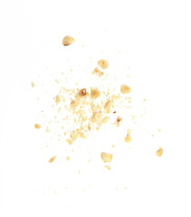 Ground, milled, crushed or granulated hazelnut pile isolated on white background