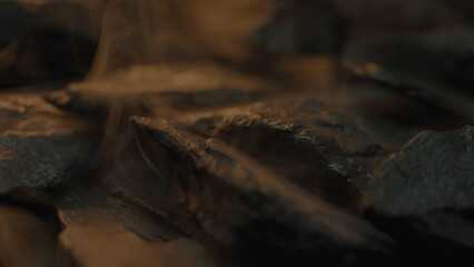 Rough abstract wet stones rotating with a foggy atmosphere around them 