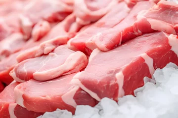 Fensteraufkleber Pieces of aw pork belly meat at butcher shop © Firn