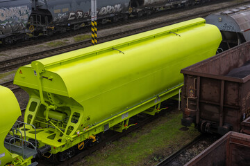 Yellow grain hopper railcar for transport of grains, weather sensitive cargo and bulk in Europe