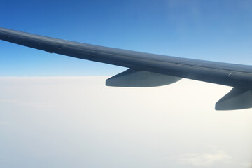 Airplane Wing Silhouetted Against Clear Blue Sky. An airplane wing against a clear blue sky....