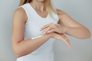 Closeup of female hands applying hand cream.Hand Skin Care