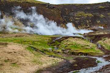 Naklejka na ściany i meble Steaming Vents and Volcanic Activity in the Mountains Near Reykjadalur Hot Spring Thermal River, Iceland