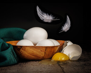 feather and eggs still life