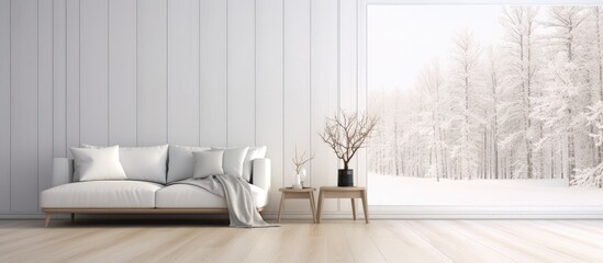 A white couch sits on a wooden floor in a stylish living room. Through a large window, a serene white landscape is visible, adding a touch of elegance to the room.