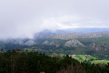 Fototapeta na wymiar View of the Sueve mountain range with clouds from the Fito viewpoint. Asturias - Spain