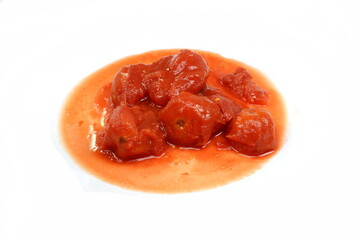 Crushed Tomatoes isolated. Tinned chopped tomatoes isolated on white background. Tomato sauce, spread with peeled tomato chunk isolated on white 