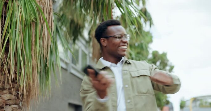 Excited, phone and dancing winner in the city with man and smile about achievement or work promotion. Mobile, outdoor and celebration with energy and happy African male person with tech and winning