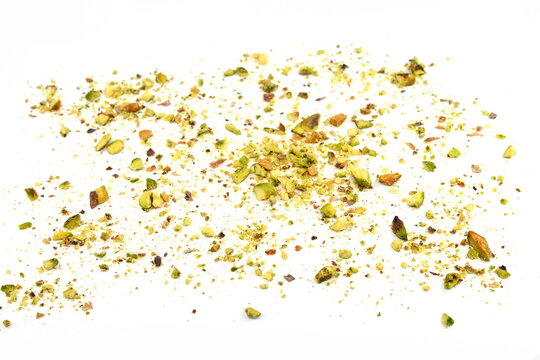 Ground, milled, crushed or granulated pistachio pile isolated on white background