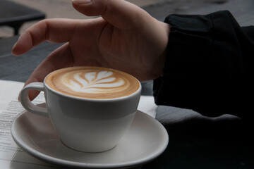 cup of coffee with hand