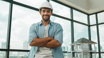 Portrait of architect engineer in casual outfit smile at camera while crossing arms. Engineer...