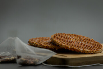 Stack of dutch waffles with caramel isolated on blur background