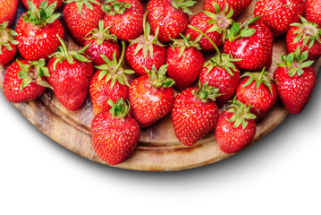 Strawberries on a plate on a wooden table - 755174814