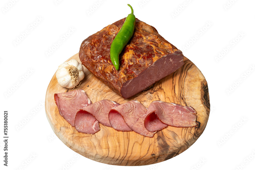 Wall mural smoked cold beef sirloin and slices on cutting board. cold roastbeef slices isolated on white backgr