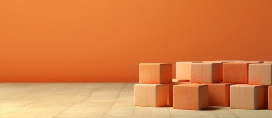 A collection of wooden blocks placed on a table in front of a vibrant orange wall. The blocks are neatly arranged, symbolizing a psychological concept related to mental health.
