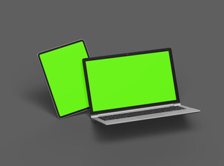 3d render of laptop and tablet with green screen on a dark background