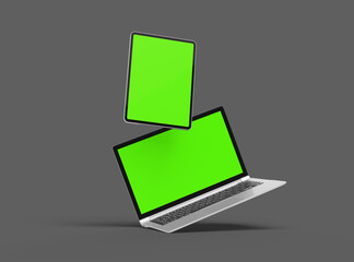 3d render of laptop and tablet with green screen on a dark background